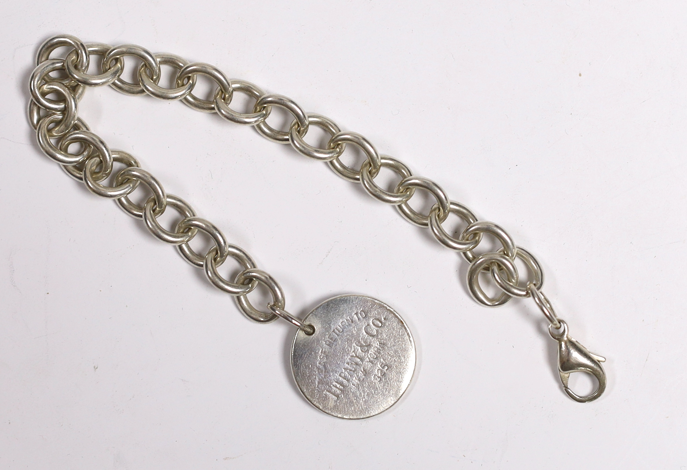 A Tiffany & Co sterling circular link bracelet with tag, 20cm excluding tag, with Tiffany pouch and box.